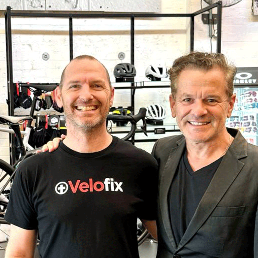 Anthony Challinor standing with Clive Burcham in the Velofix workshop